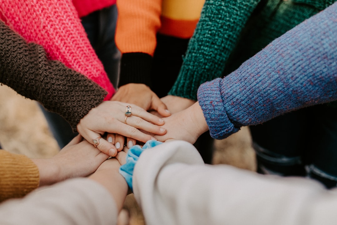 Hands together in community support